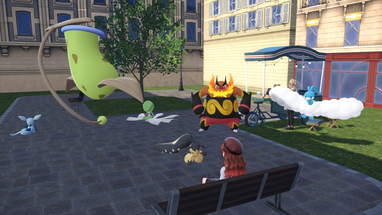 Pokémon team seated around a bench